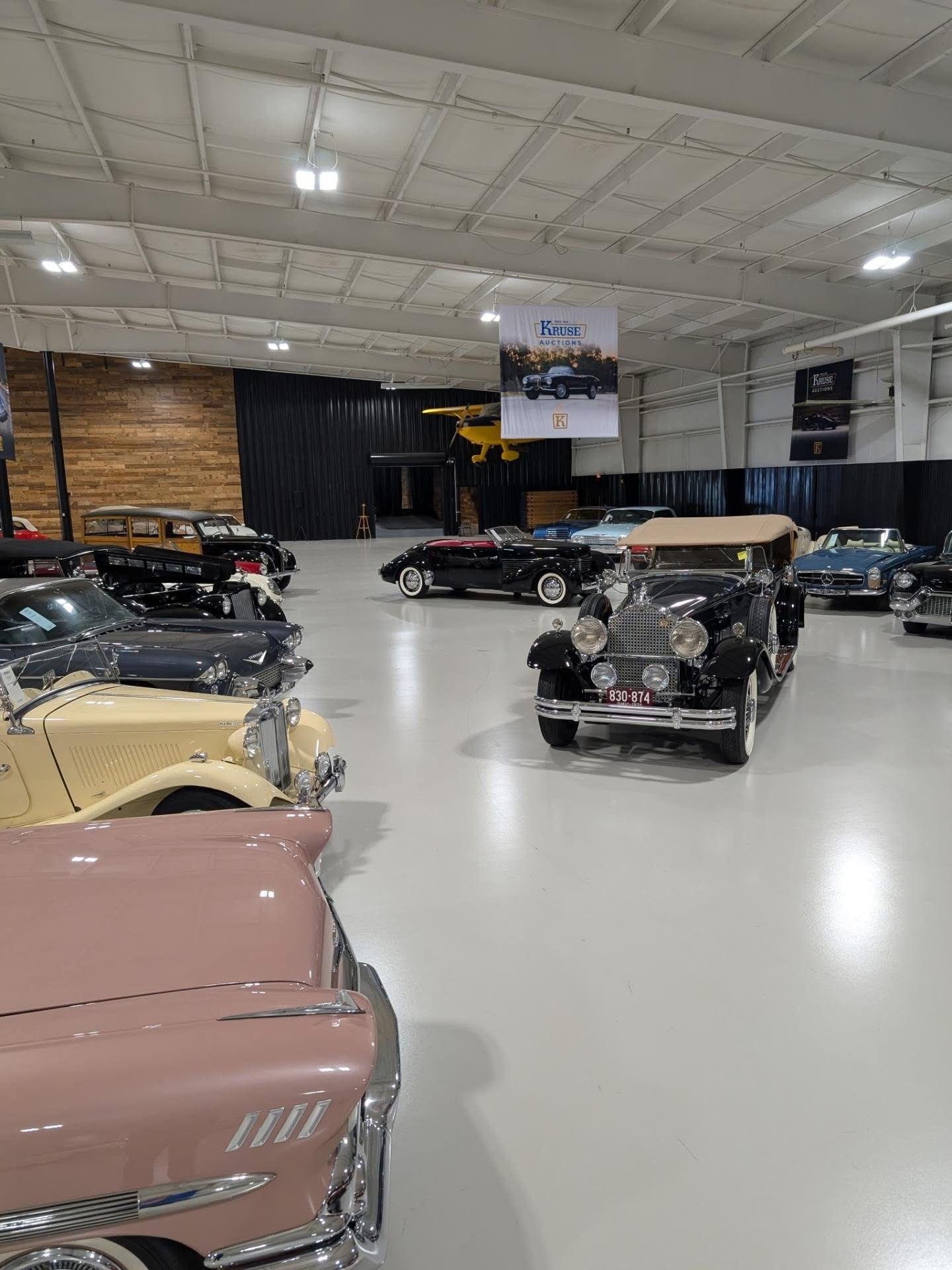 Collector cars inside the Auburn Classic Cars showroom